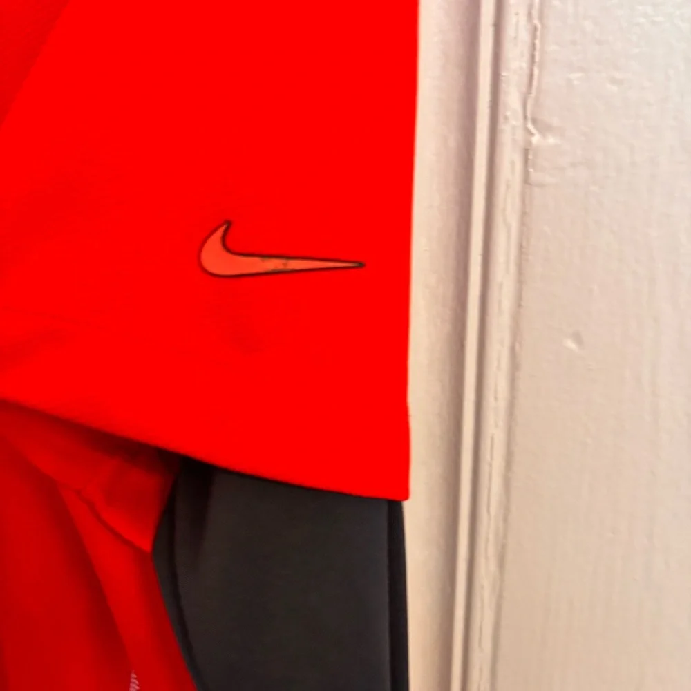 Nike women’s golf polo red with black sleeves slim fit